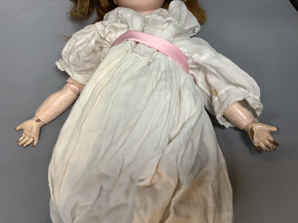 A French Mon Cheri doll, with jointed body, height 20 inches, 51cm